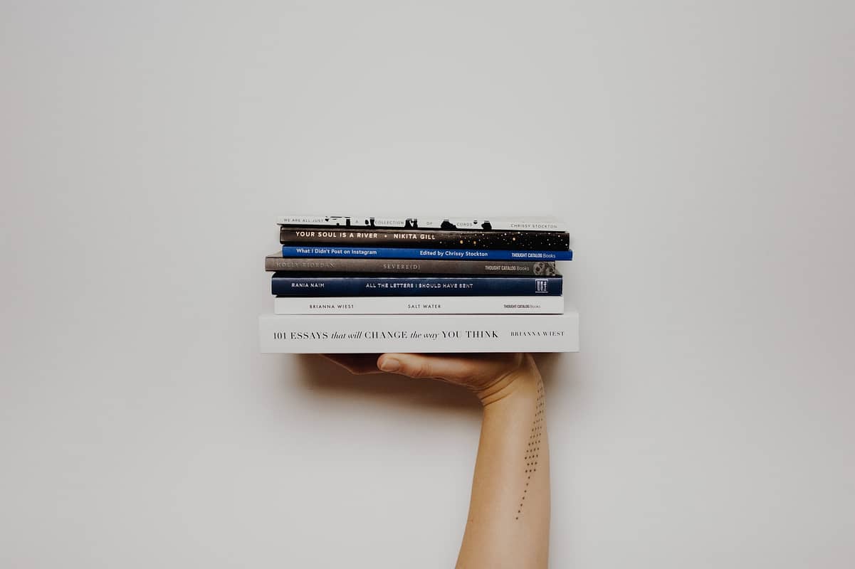 This image shows a stack of books to read on various topics.