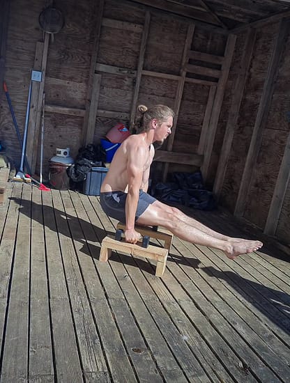 This image shows me doing an L-Sit on Parallettes for Calisthenics strenth training.