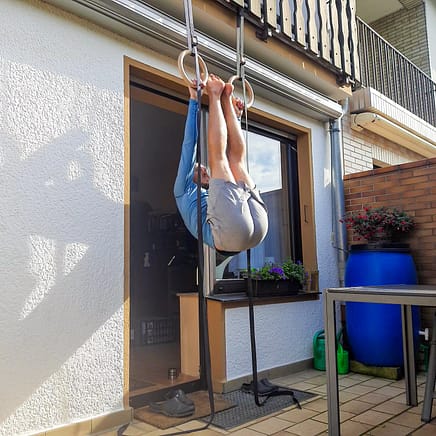 This image shows me doing a hanging leg raise on rings.