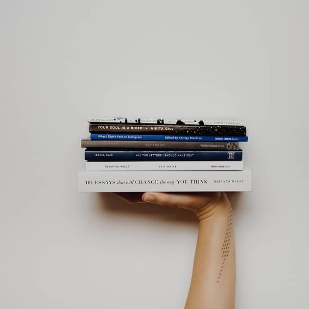 This image shows a stack of books to read on various topics.