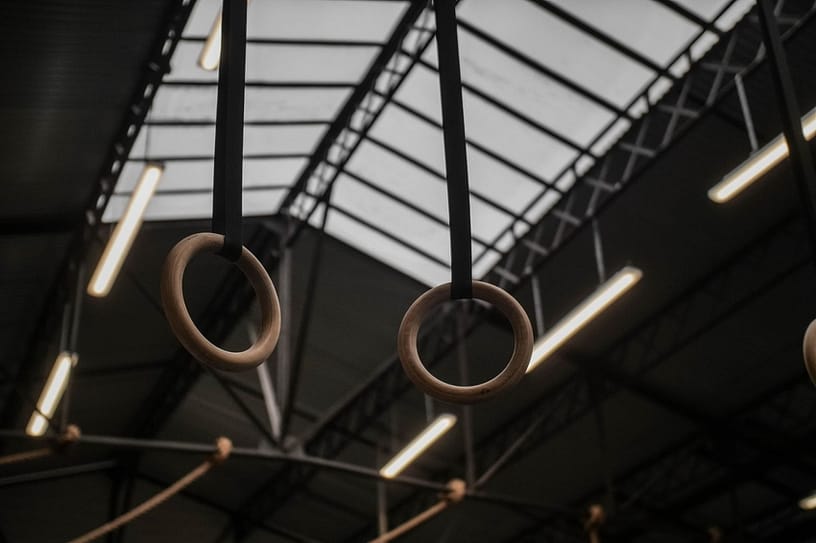 Gymnastic Rings hanging down from the Ceiling.