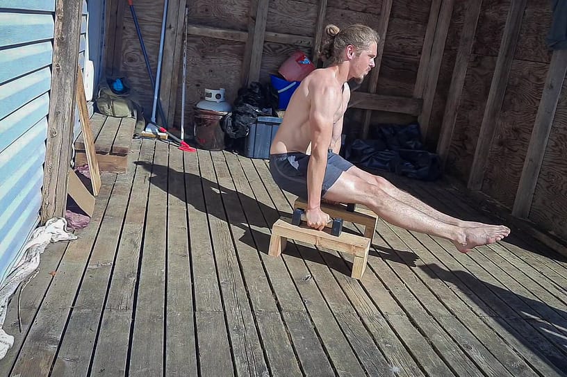 This image shows me doing an L-Sit on Parallettes for Calisthenics strenth training.